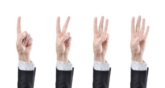 four hands showing one, two, three and four fingers